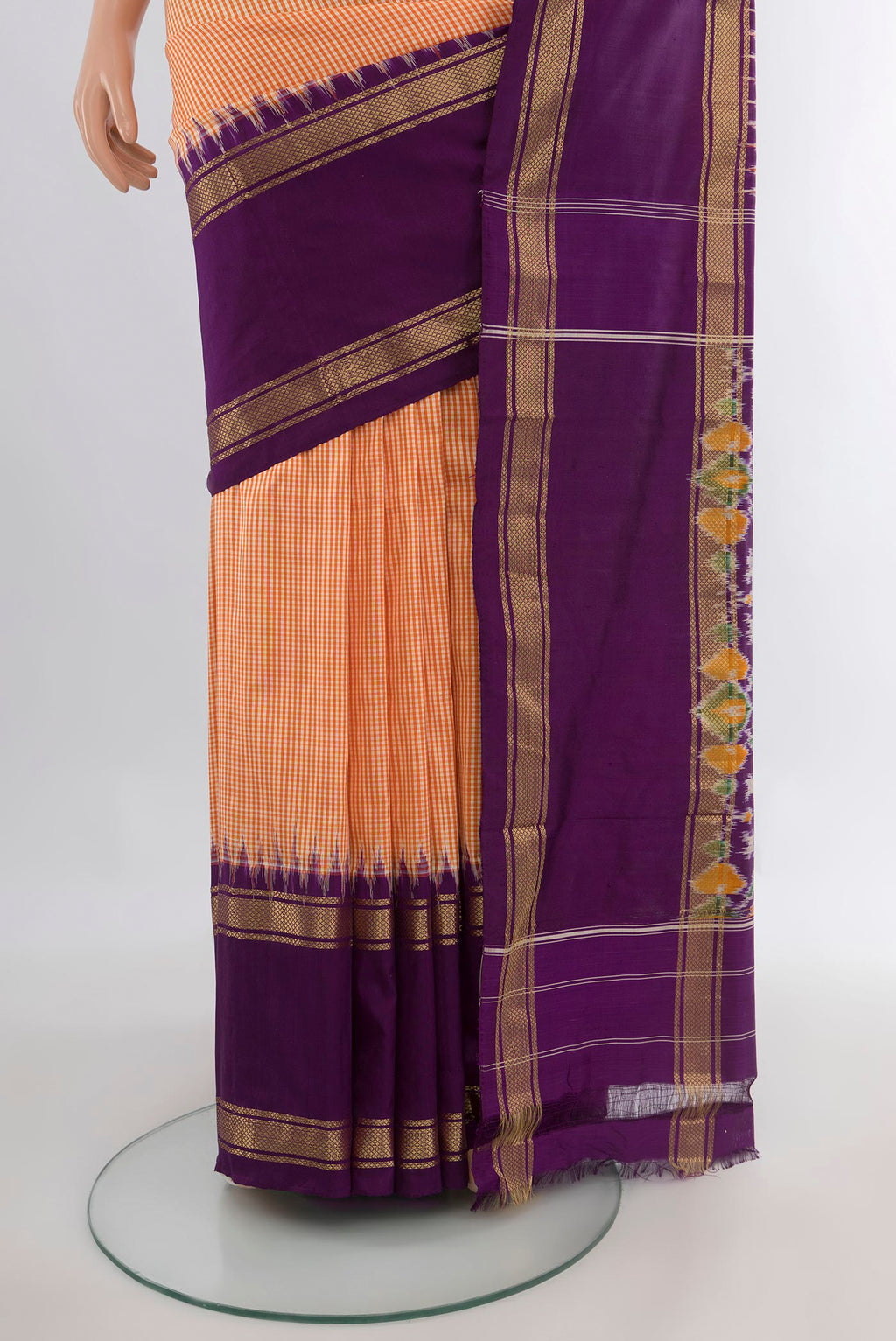 Pleats and pallu of Pure Silk Orange Pochampally Saree with Checked design on the body and Zari Border. 