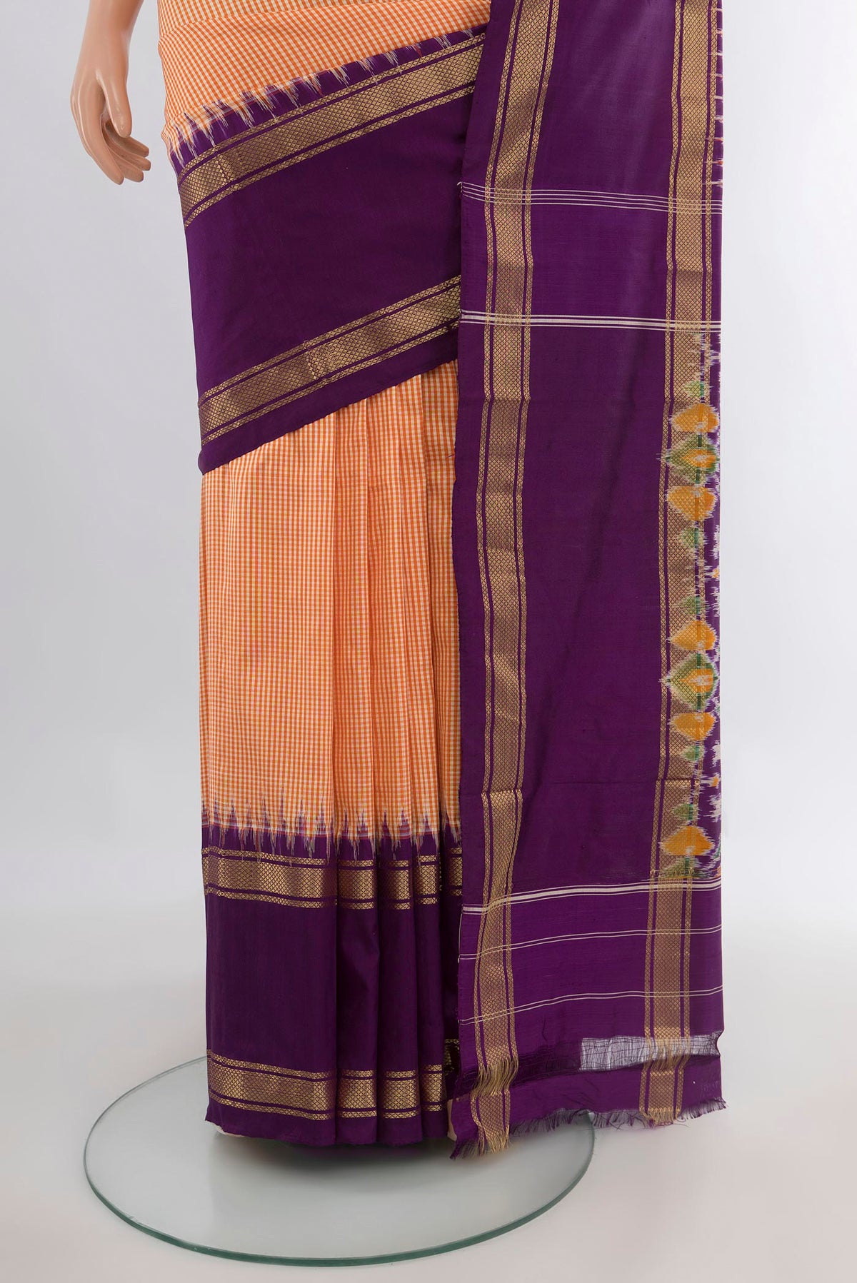 Pleats and pallu of Pure Silk Orange Pochampally Saree with Checked design on the body and Zari Border. 