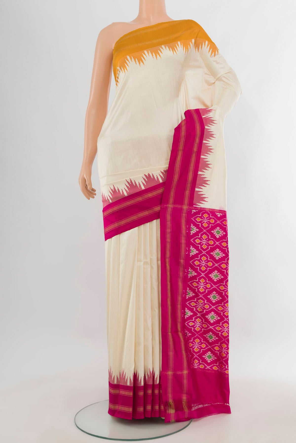Pure Silk Cream Pochampally Saree with Plain Body and Ganga Jamuna Border.  displayed on a mannequin