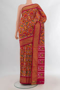 Pure Silk Orange Pochampally Saree with Pure Ikat on the body and Zari Border.  displayed on a mannequin