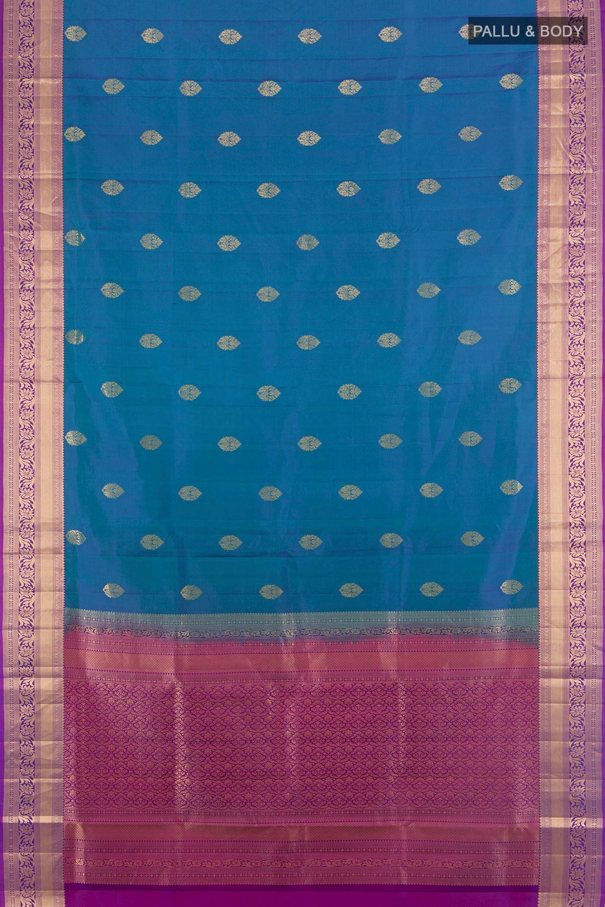 Flat view of Pure Silk Peacock Blue Soft Saree with Zari Butta on the body and Zari Border. 