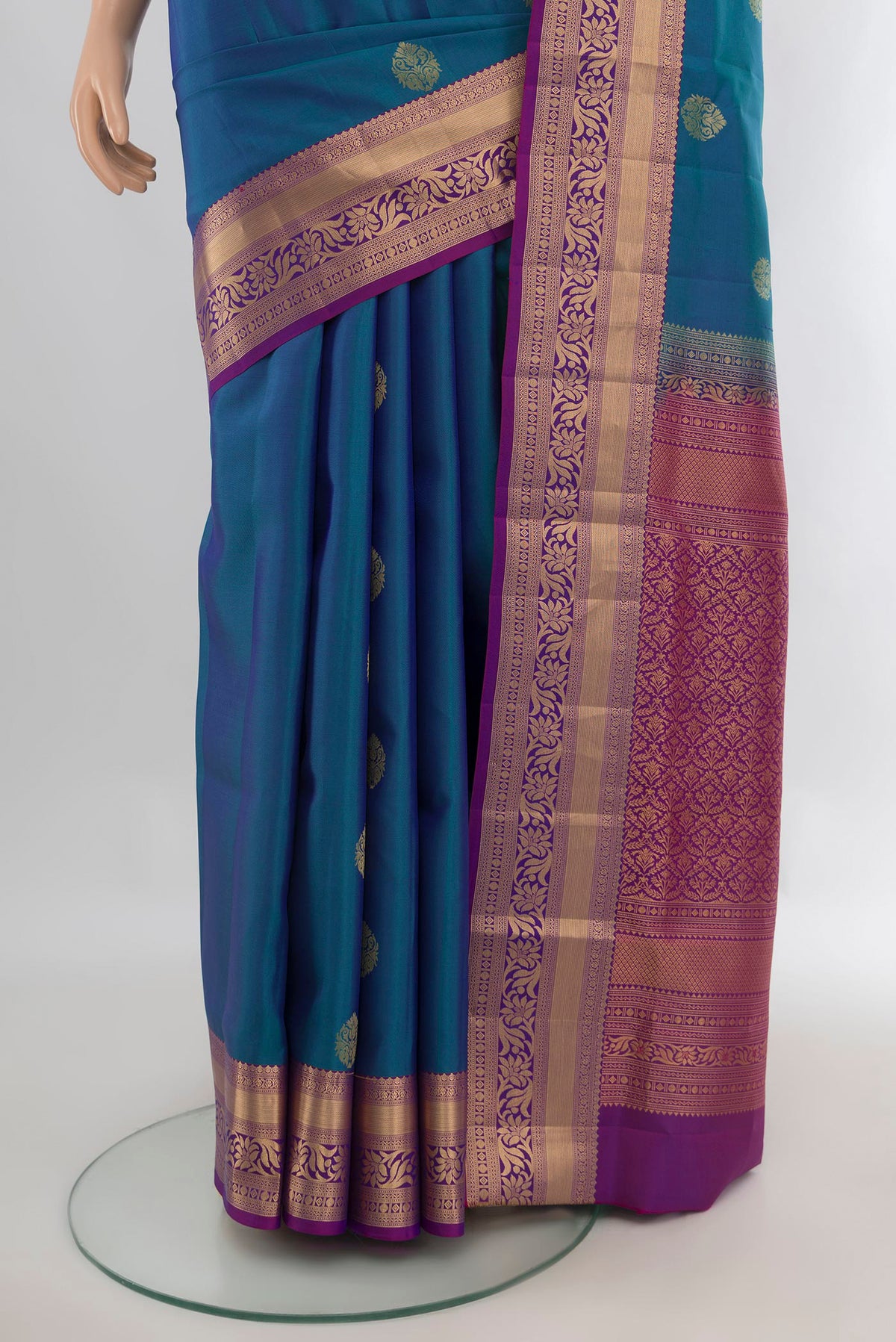 Pleats and pallu of Pure Silk Peacock Blue Soft Saree with Zari Butta on the body and Zari Border. 