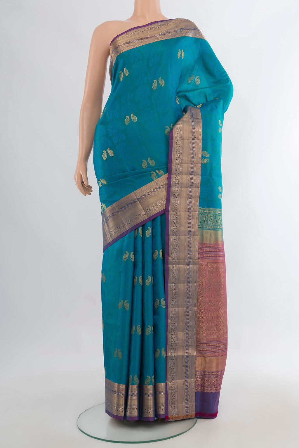 Pure Silk Peacock Blue Soft Saree with Jacquard With Zari Butta on the body and Zari Border.  displayed on a mannequin