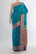 Pure Silk Peacock Blue Soft Saree with Jacquard With Zari Butta on the body and Zari Border.  displayed on a mannequin