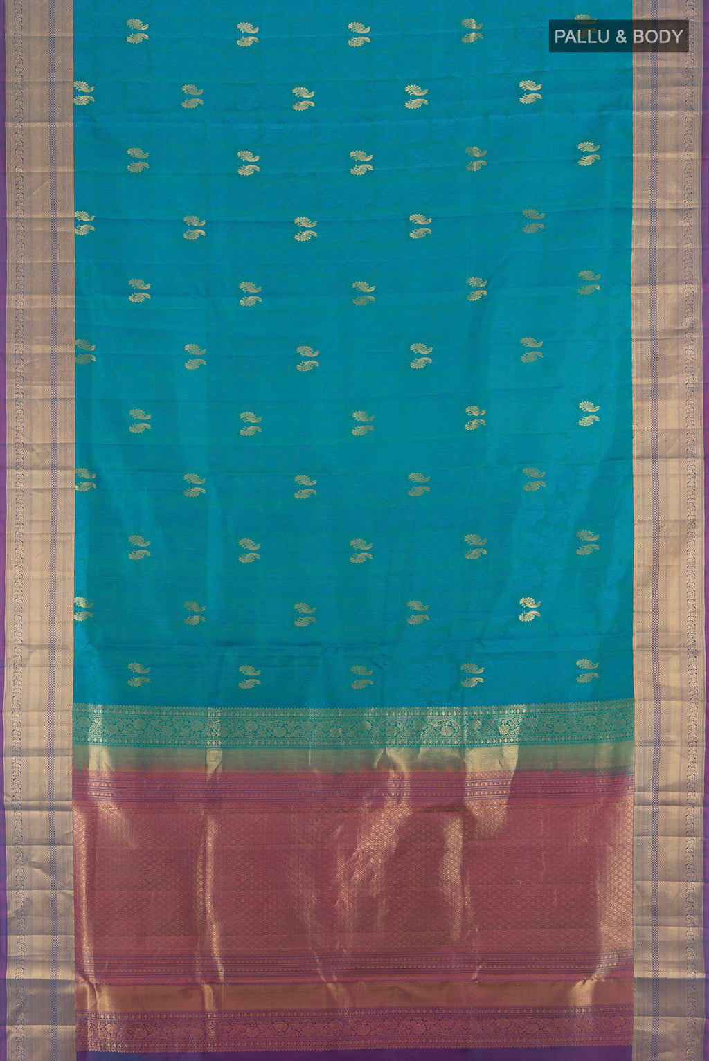 Flat view of Pure Silk Peacock Blue Soft Saree with Jacquard With Zari Butta on the body and Zari Border. 