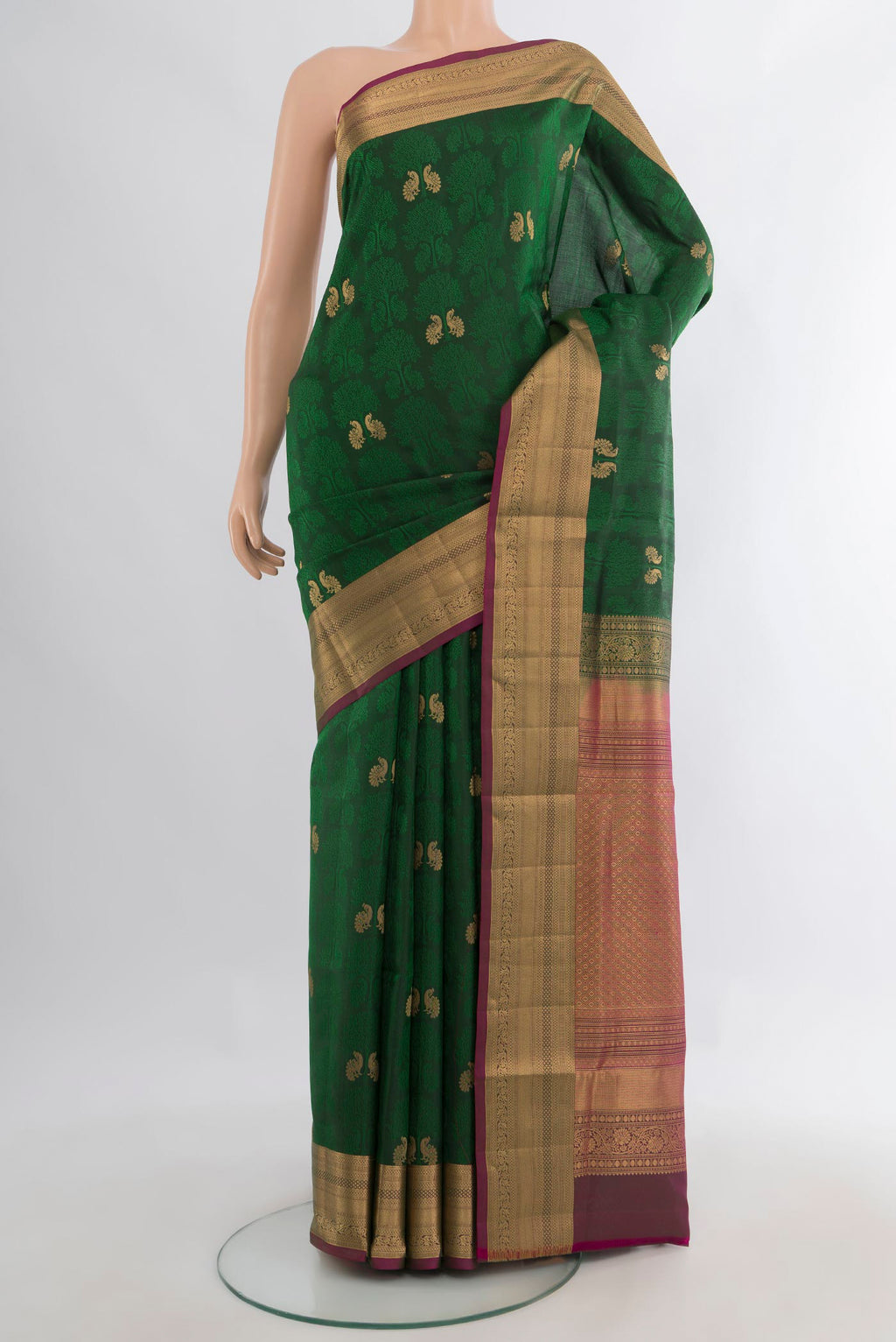 Pure Silk Bottle Green Soft Saree with Jacquard With Zari Butta on the body and Zari Border.  displayed on a mannequin