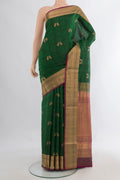 Pure Silk Bottle Green Soft Saree with Jacquard With Zari Butta on the body and Zari Border.  displayed on a mannequin