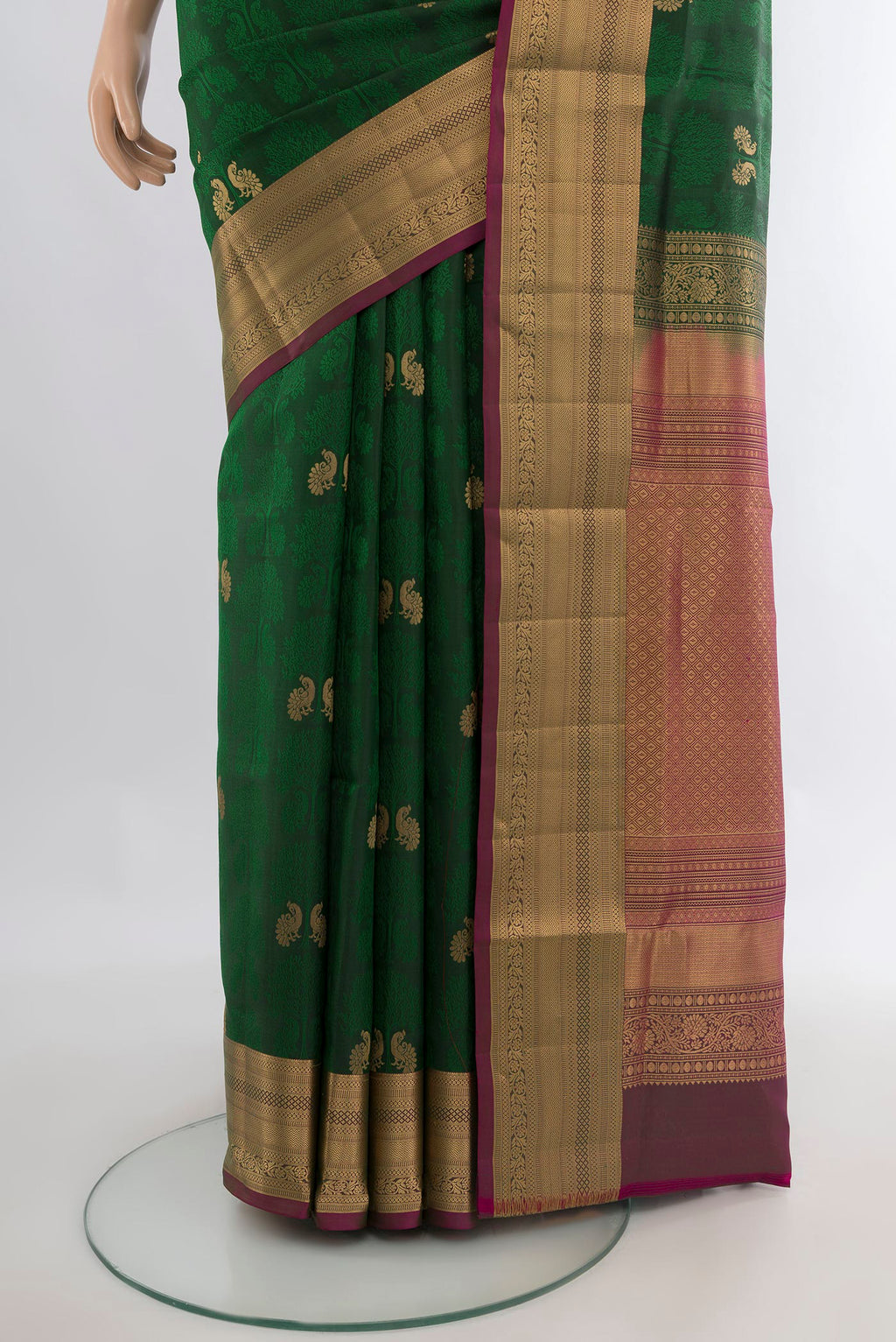 Pleats and pallu of Pure Silk Bottle Green Soft Saree with Jacquard With Zari Butta on the body and Zari Border. 