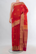 Pure Silk Brick Orange Soft Saree with Jacquard design on the body and Zari Border.  displayed on a mannequin