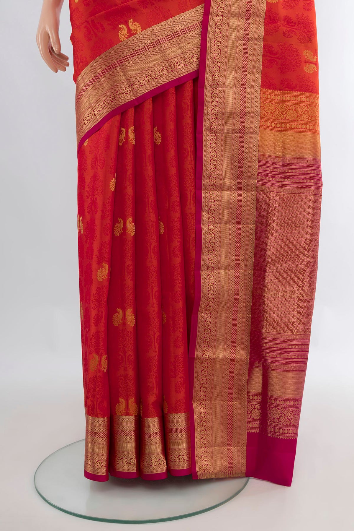 Pleats and pallu of Pure Silk Brick Orange Soft Saree with Jacquard design on the body and Zari Border. 