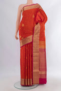 Pure Silk Brick Orange Soft Saree with Zari Butta on the body and Zari Border.  displayed on a mannequin