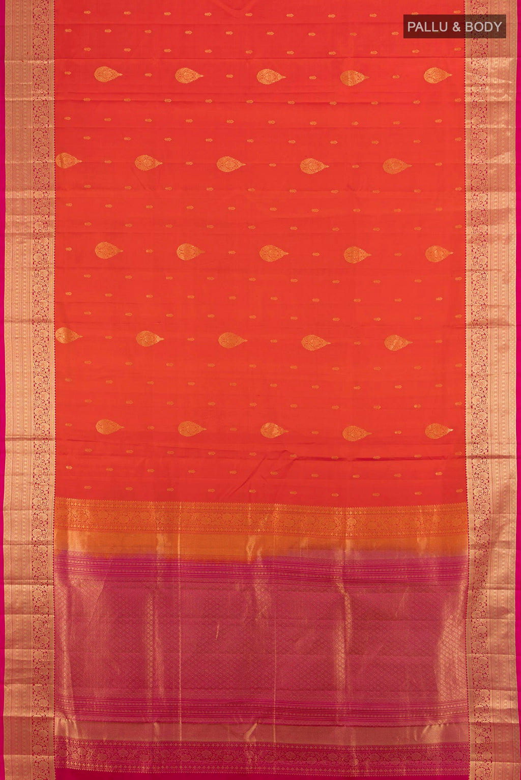 Flat view of Pure Silk Brick Orange Soft Saree with Zari Butta on the body and Zari Border. 