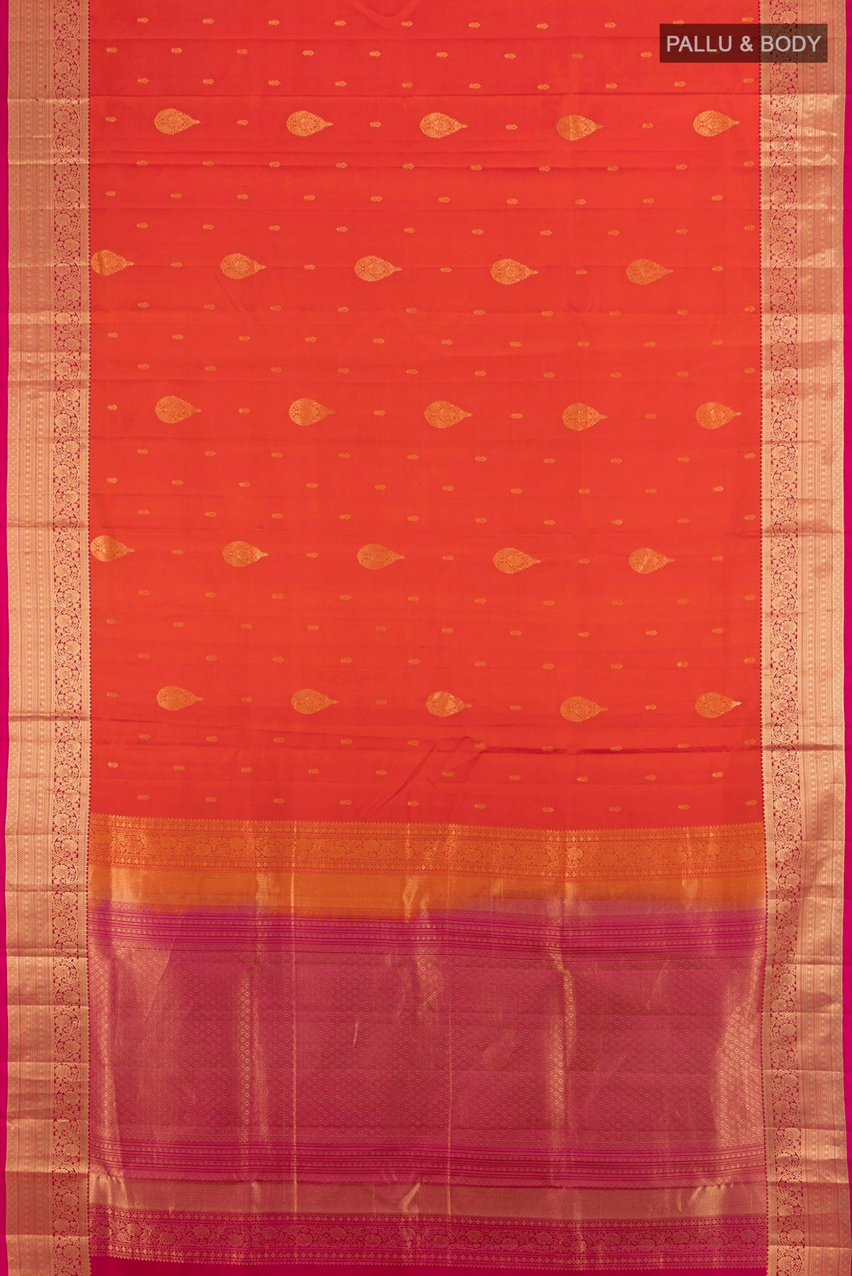 Flat view of Pure Silk Brick Orange Soft Saree with Zari Butta on the body and Zari Border. 