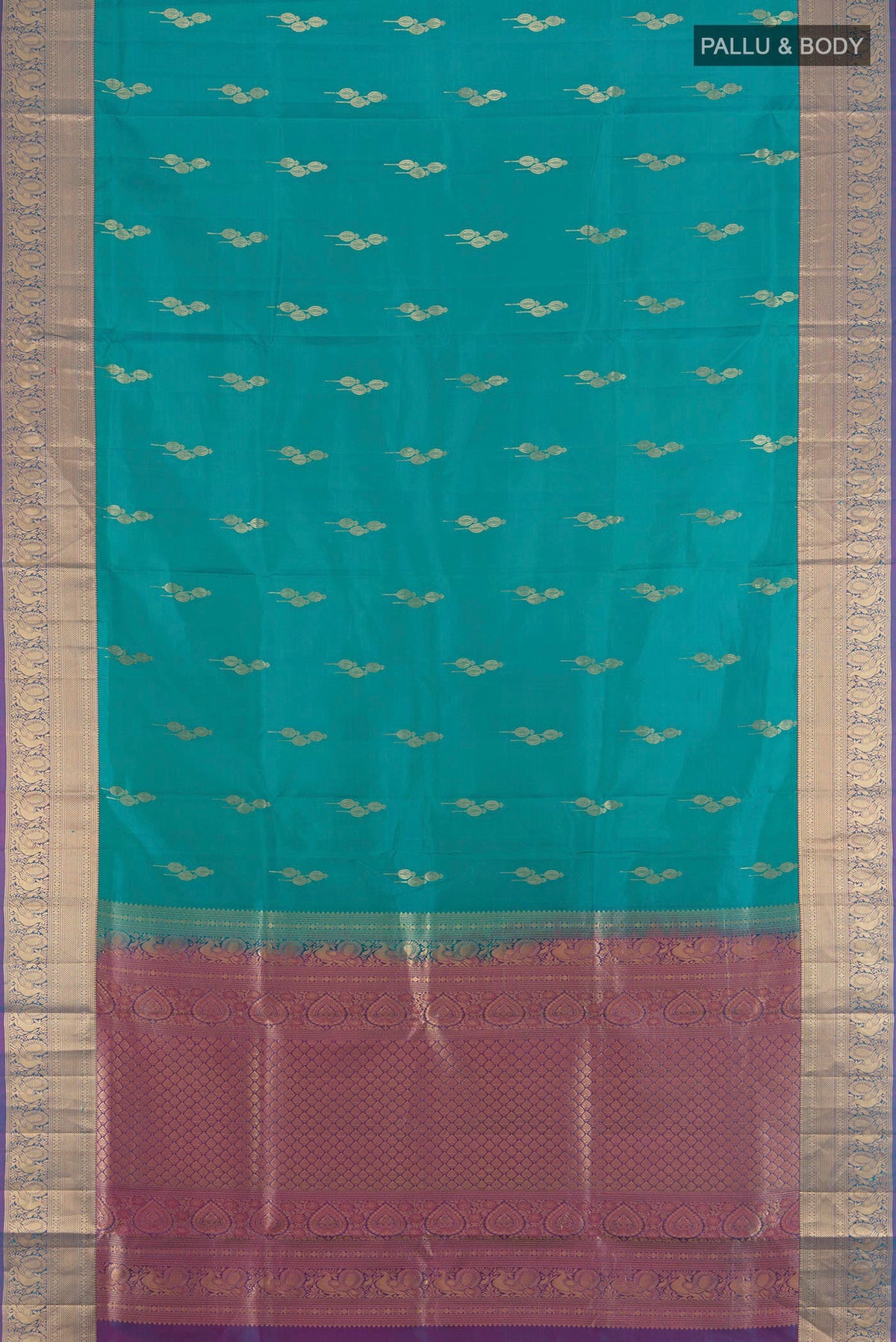 Flat view of Pure Silk Peacock Blue Soft Saree with Zari Butta on the body and Zari Border. 