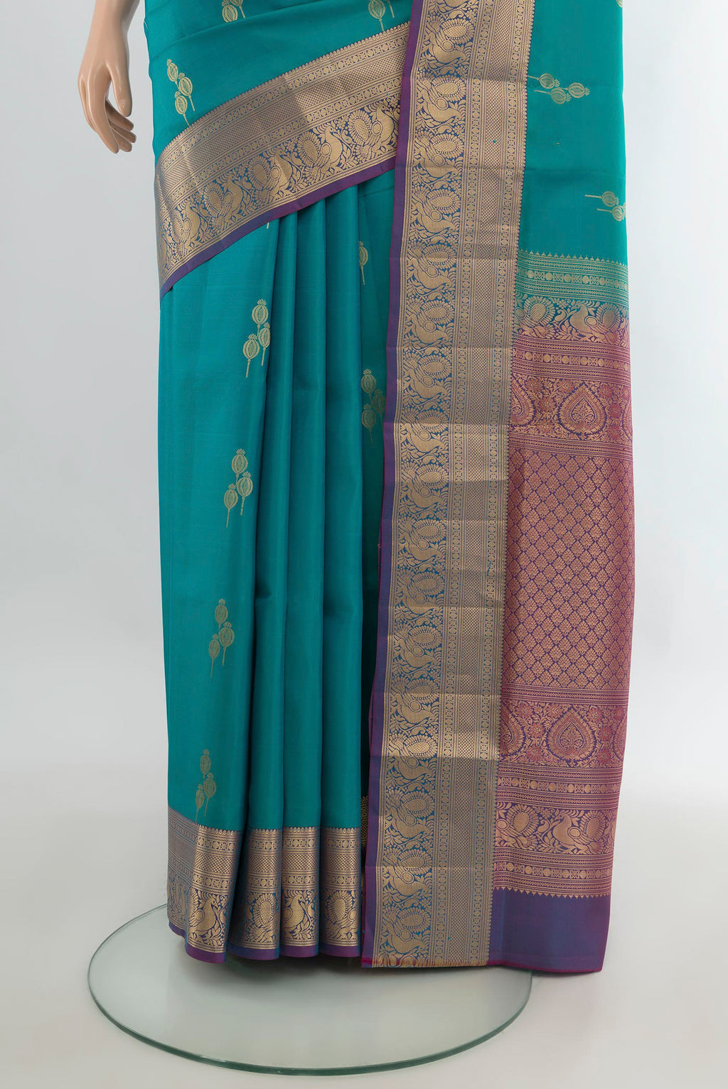 Pleats and pallu of Pure Silk Peacock Blue Soft Saree with Zari Butta on the body and Zari Border. 