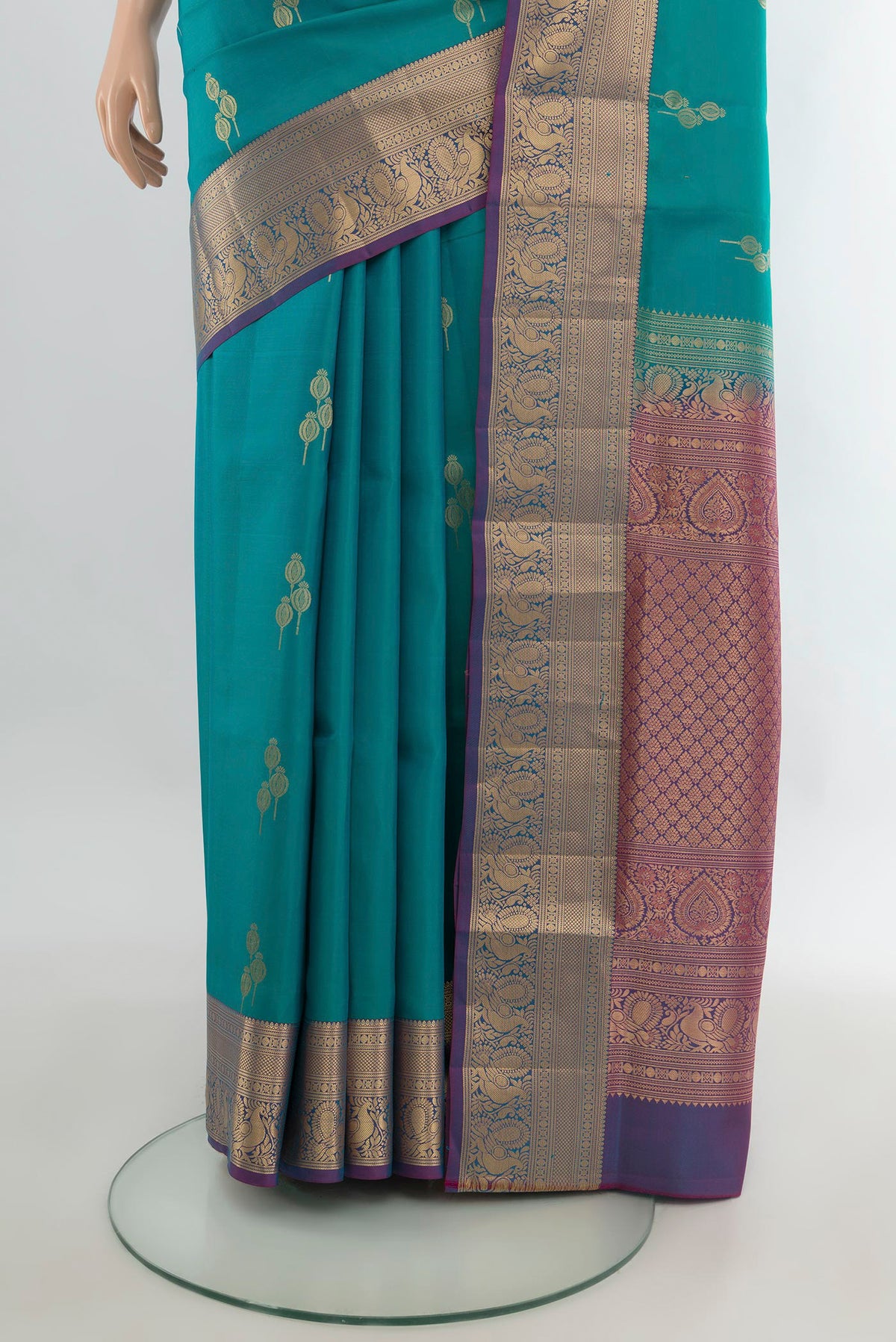 Pleats and pallu of Pure Silk Peacock Blue Soft Saree with Zari Butta on the body and Zari Border. 