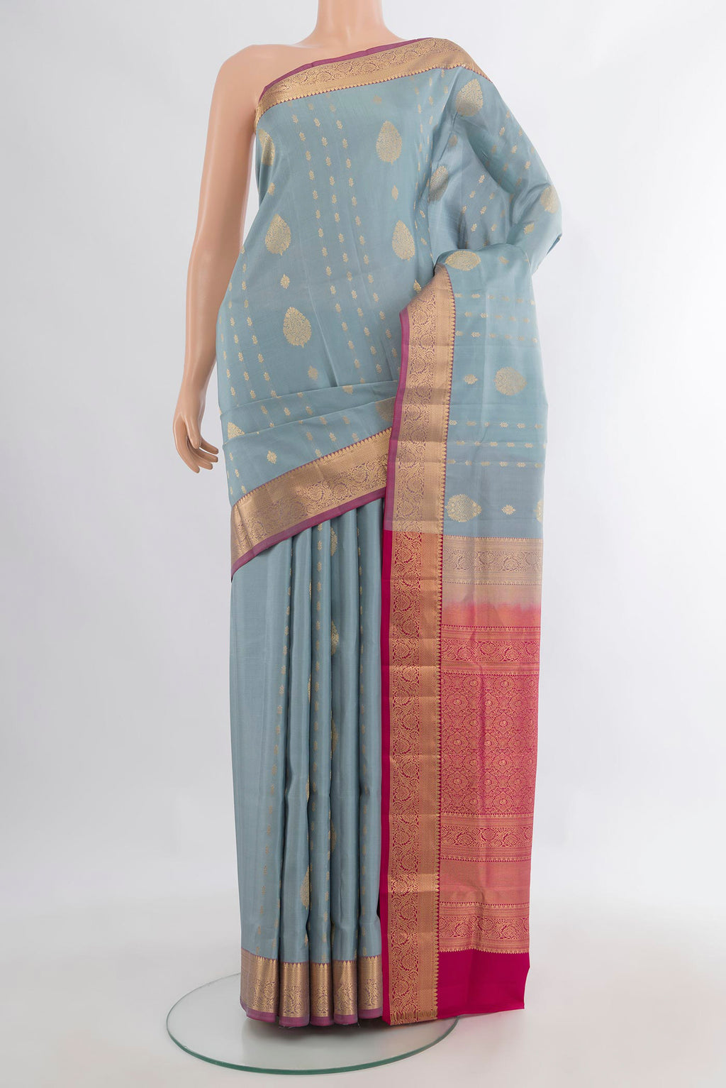 Pure Silk Davys Grey Soft Saree with Zari Butta on the body and Zari Border.  displayed on a mannequin