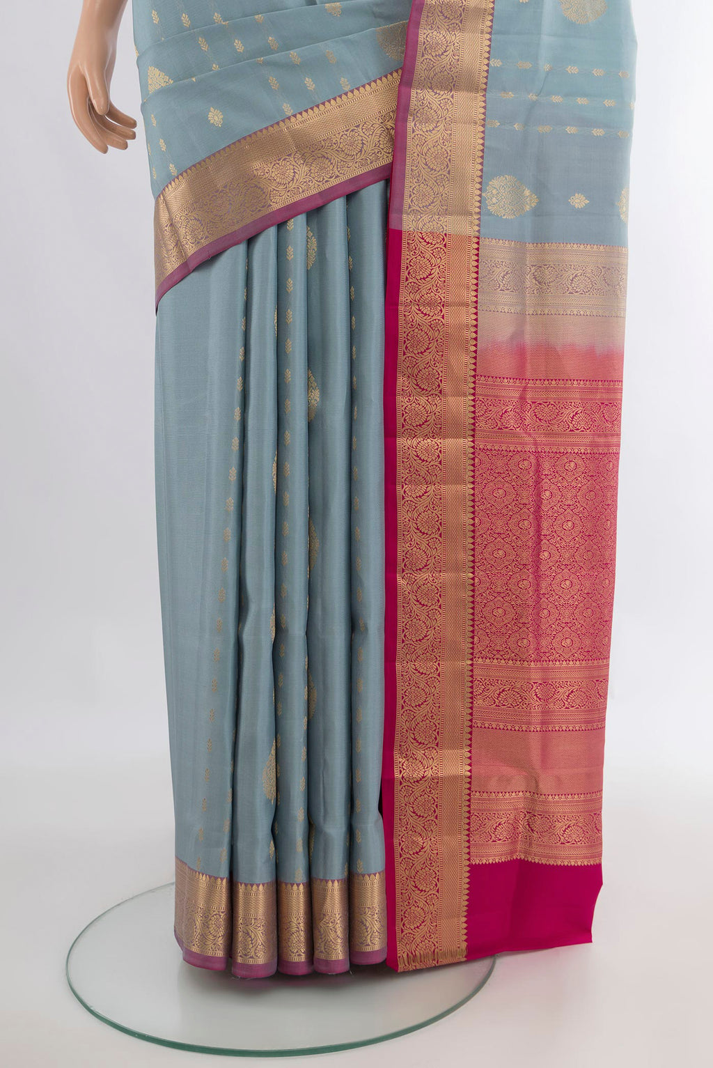 Pleats and pallu of Pure Silk Davys Grey Soft Saree with Zari Butta on the body and Zari Border. 
