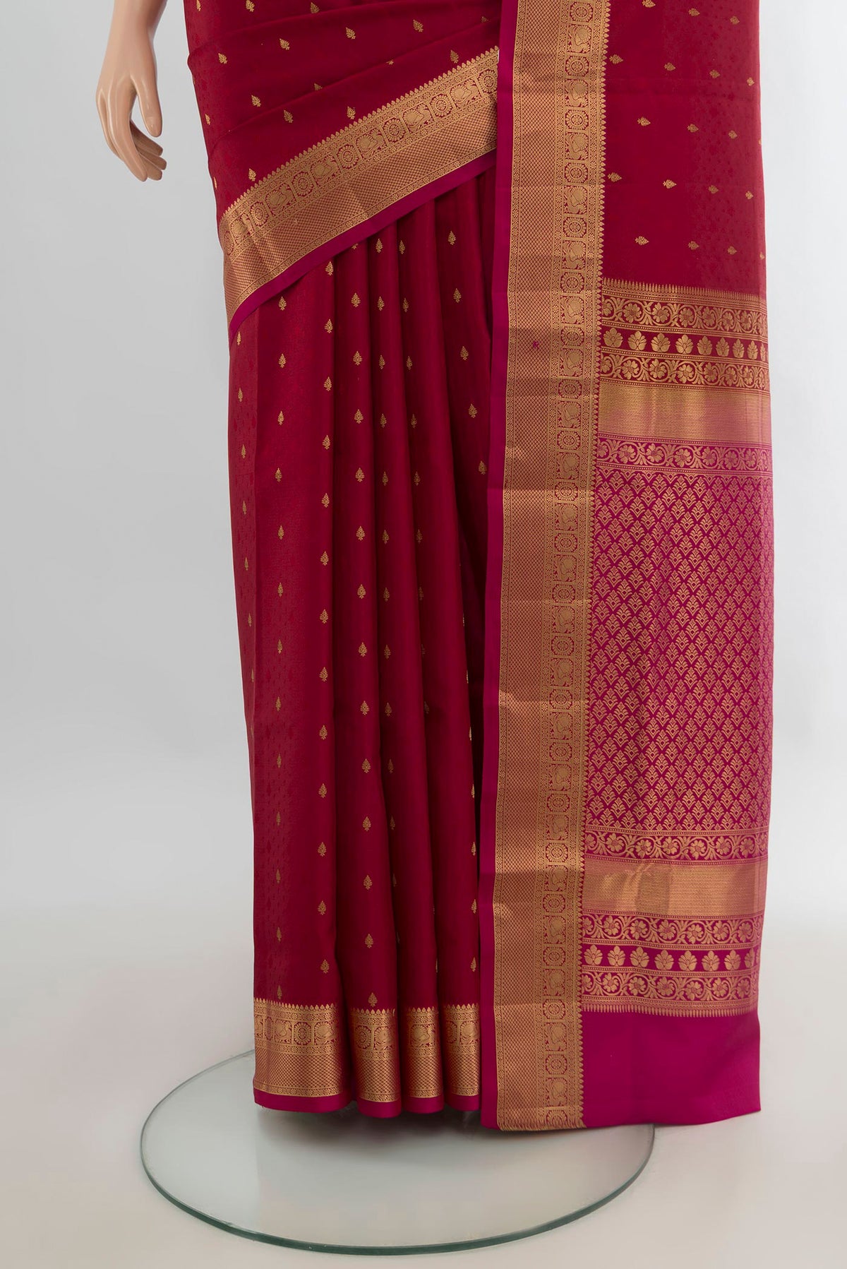 Pleats and pallu of Pure Silk Red Soft Saree with Zari Butta on the body and Zari Border. 