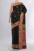 Pure Silk Black Soft Saree with Zari Butta on the body and Zari Border.  displayed on a mannequin