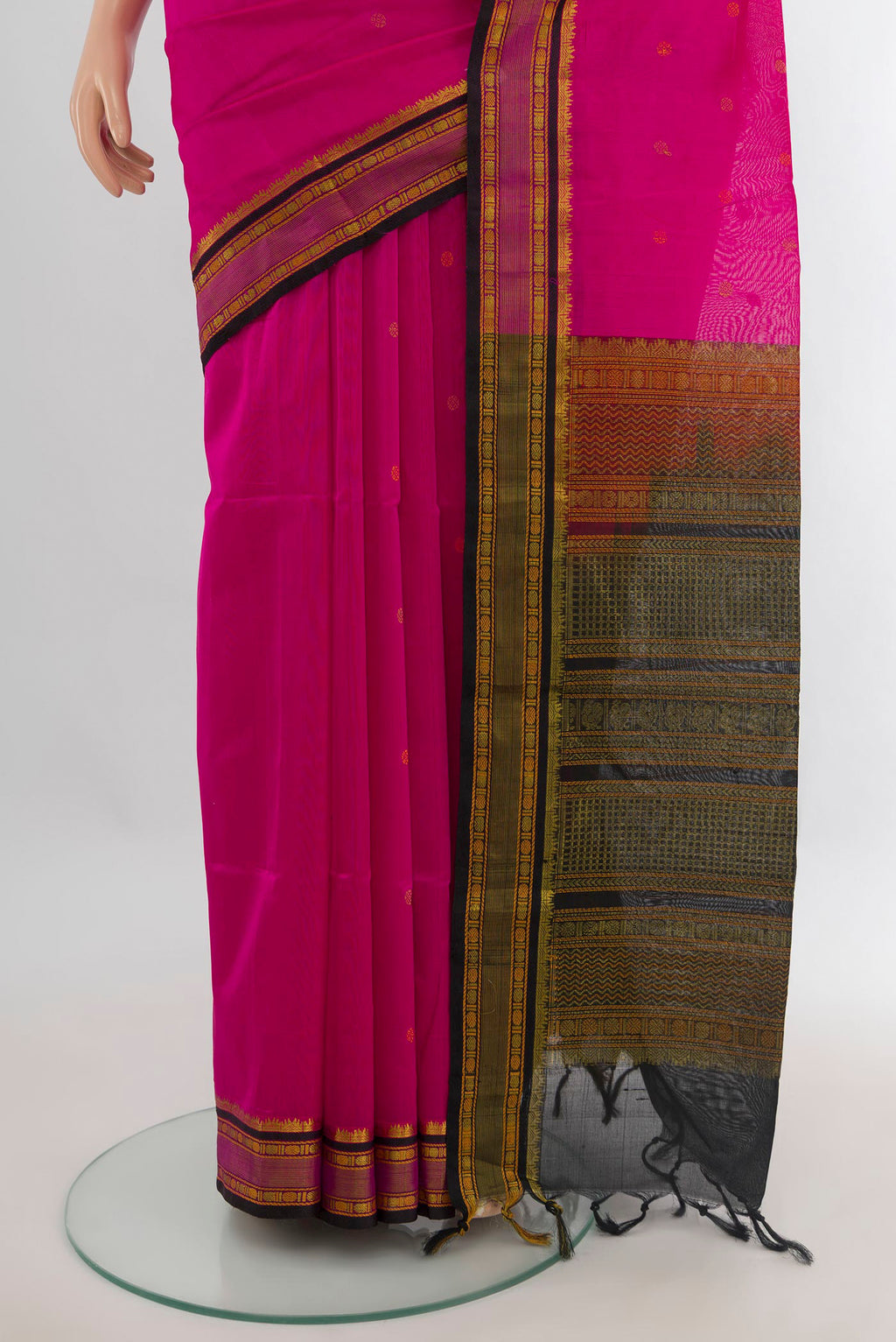 Pleats and pallu of Rani Pink Silk Cotton Saree with Thread Butta on the body and Zari Border. 