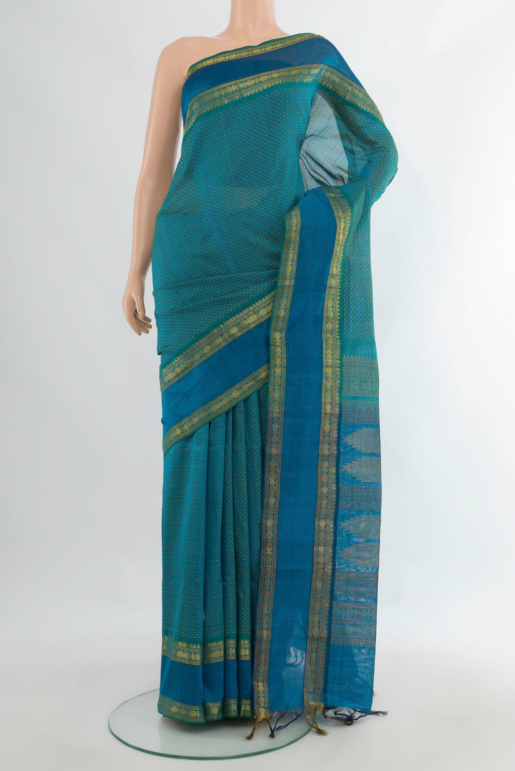 Sea Green Silk Cotton Saree with Thread Butta on the body and Zari Border.  displayed on a mannequin