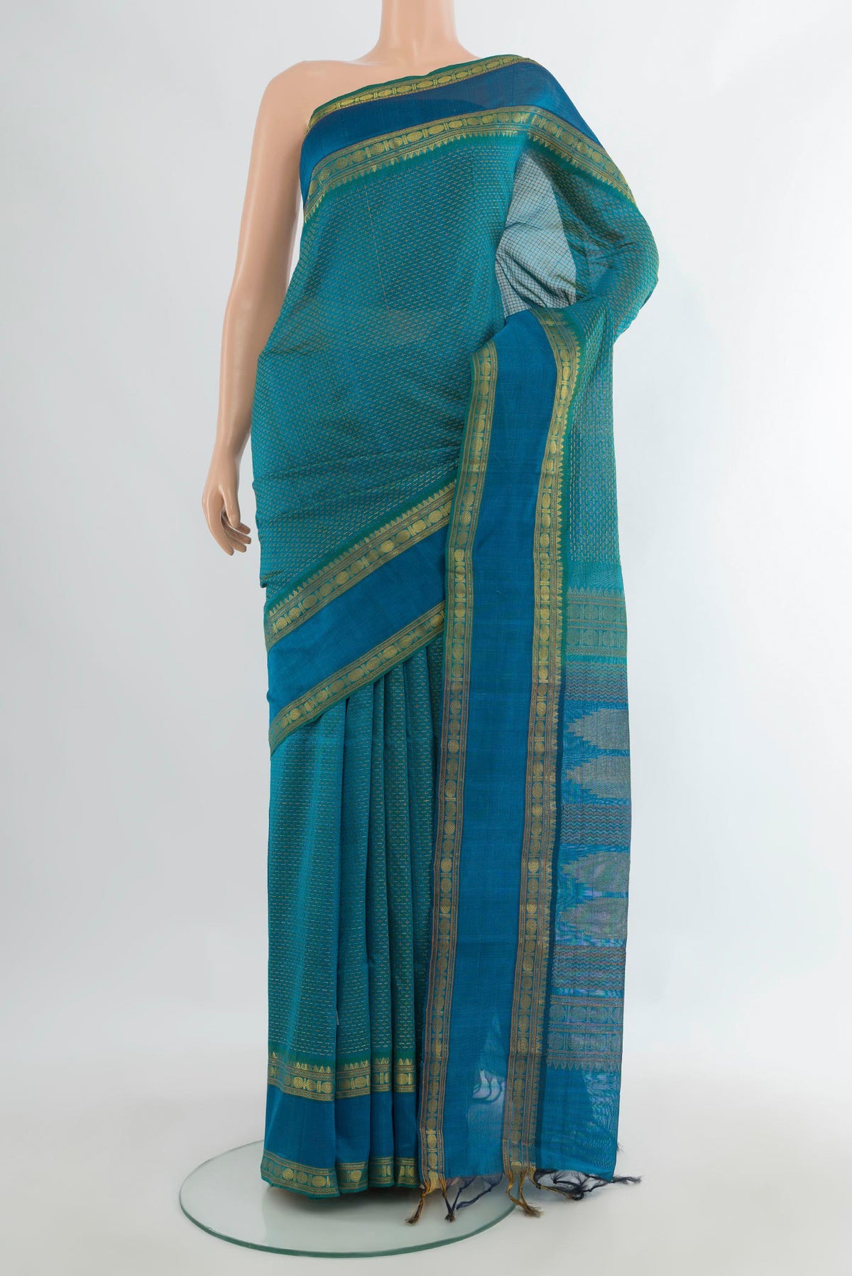 Sea Green Silk Cotton Saree with Thread Butta on the body and Zari Border.  displayed on a mannequin