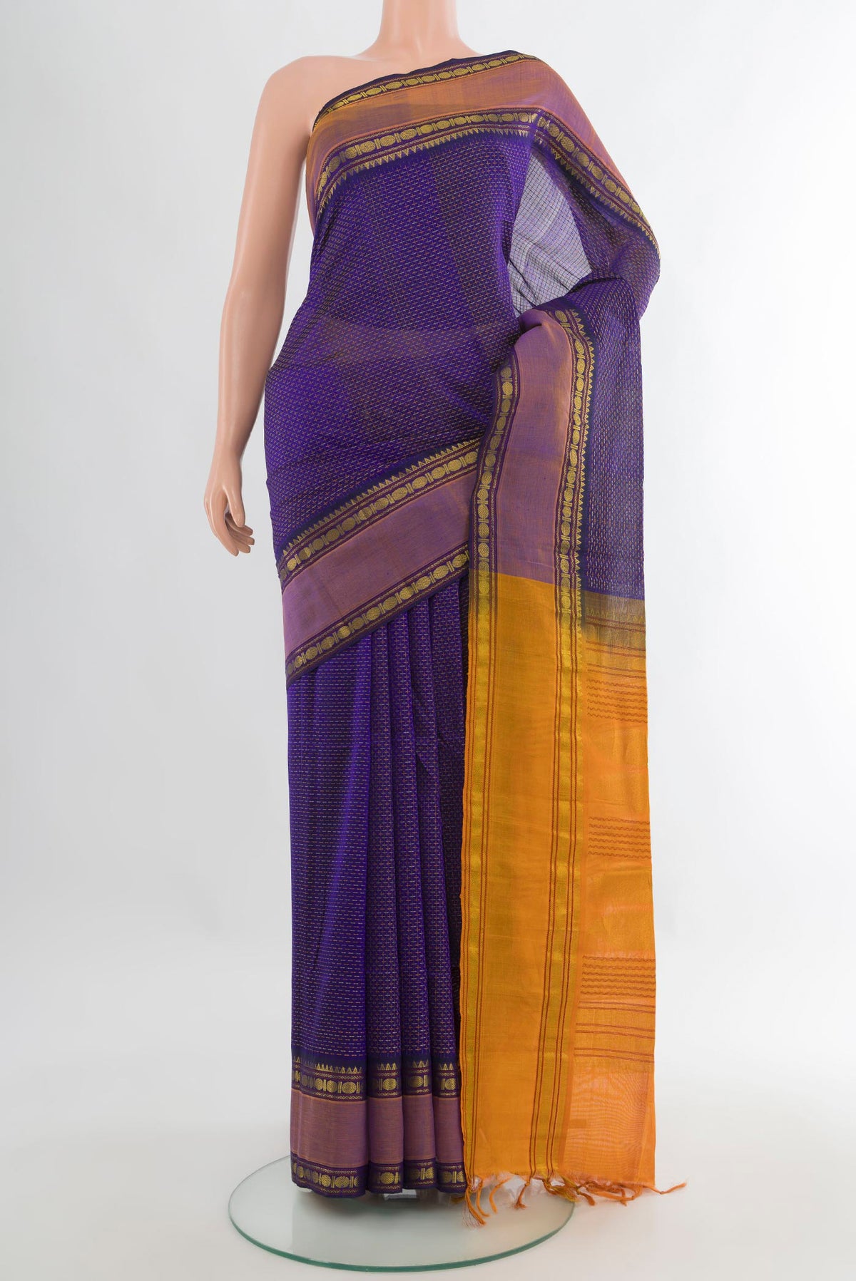 Violet Silk Cotton Saree with Checked design on the body and Zari Border.  displayed on a mannequin