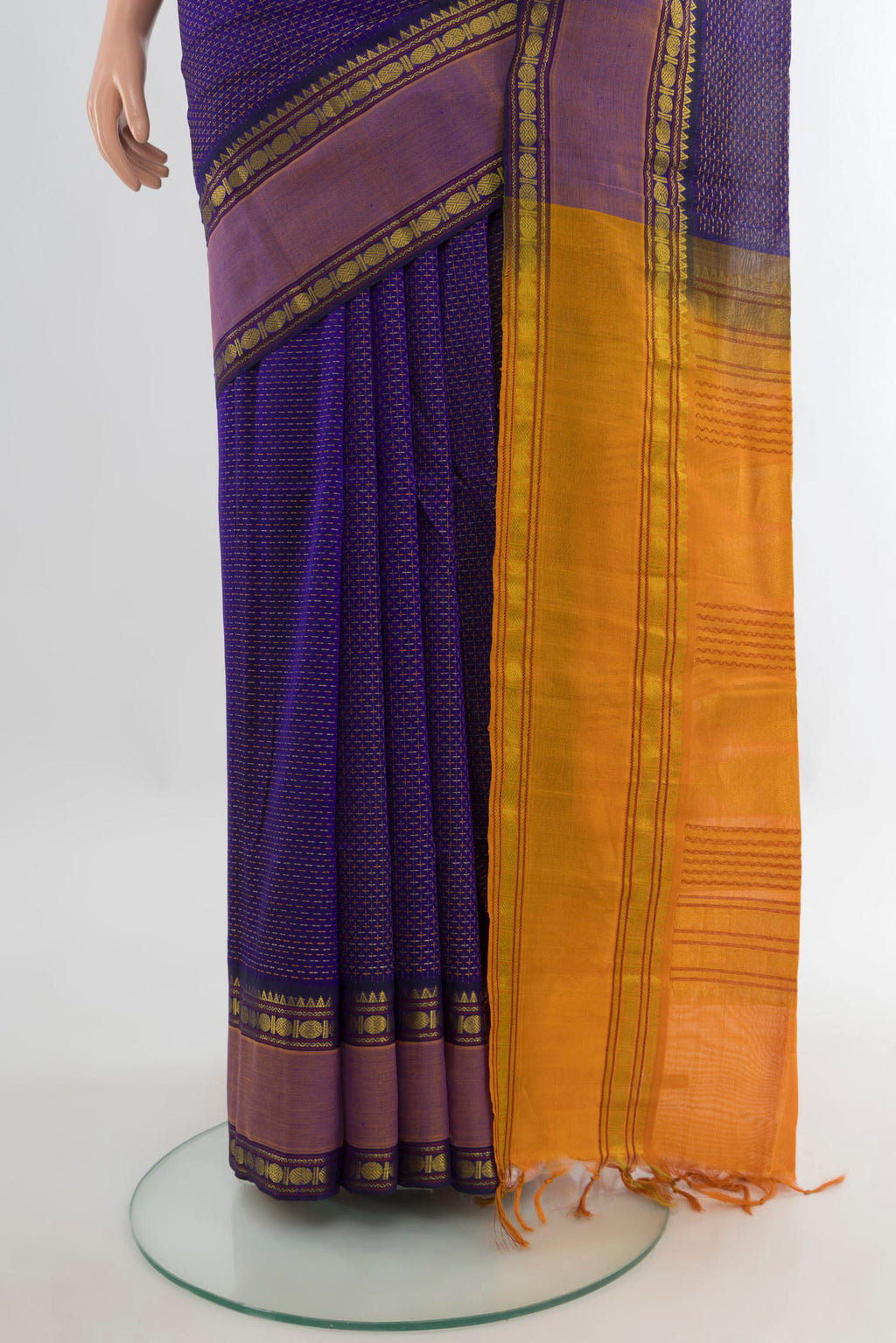 Pleats and pallu of Violet Silk Cotton Saree with Checked design on the body and Zari Border. 
