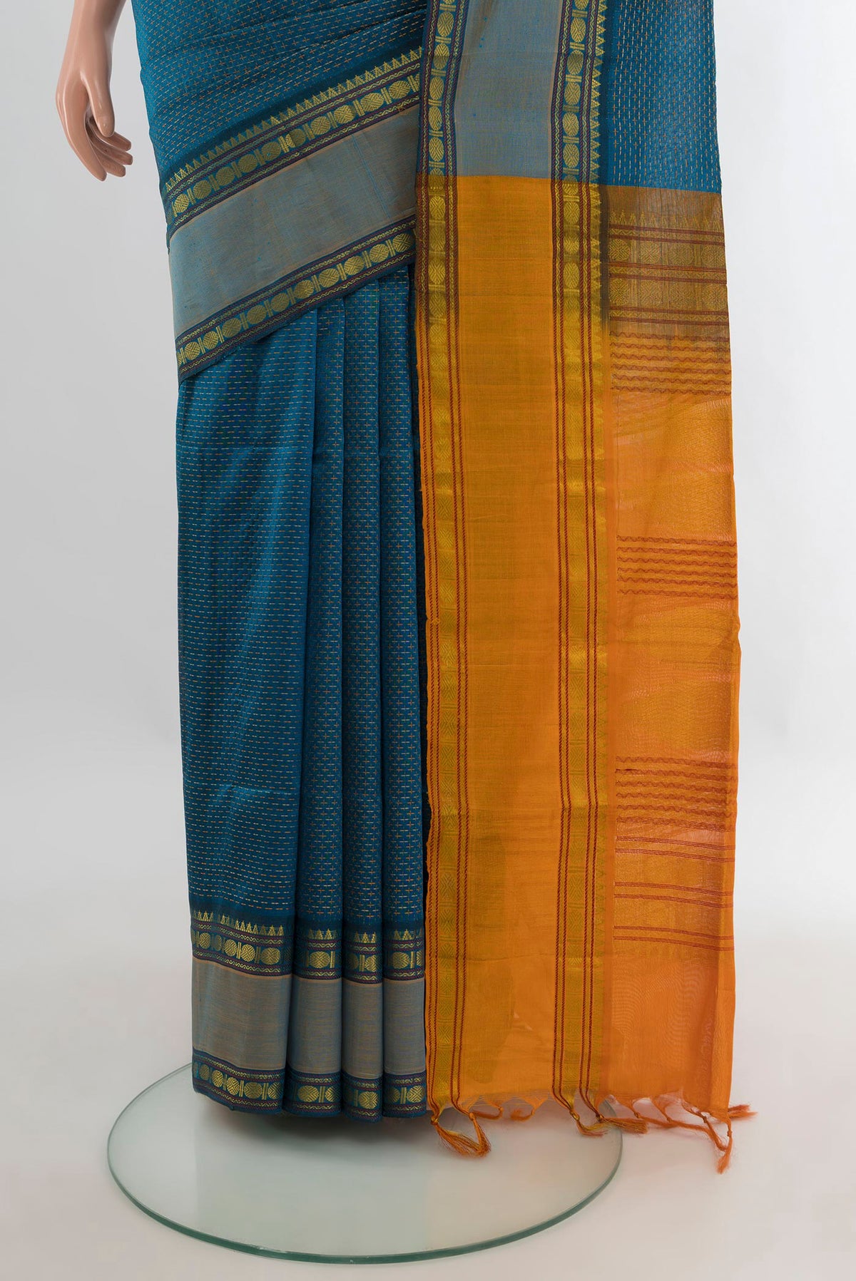 Pleats and pallu of Peacock Blue Silk Cotton Saree with Checked design on the body and Zari Border. 