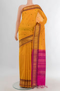Yellow Silk Cotton Saree with Thread Butta on the body and Zari Border.  displayed on a mannequin
