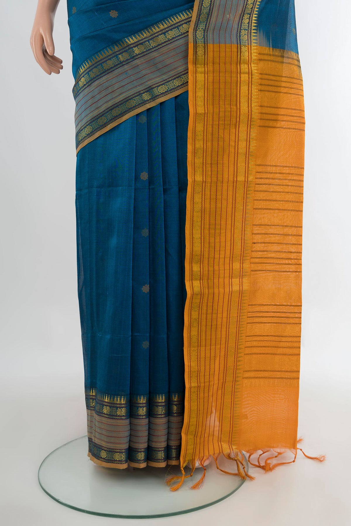 Pleats and pallu of Blue Silk Cotton Saree with Thread Butta on the body and Zari Border. 