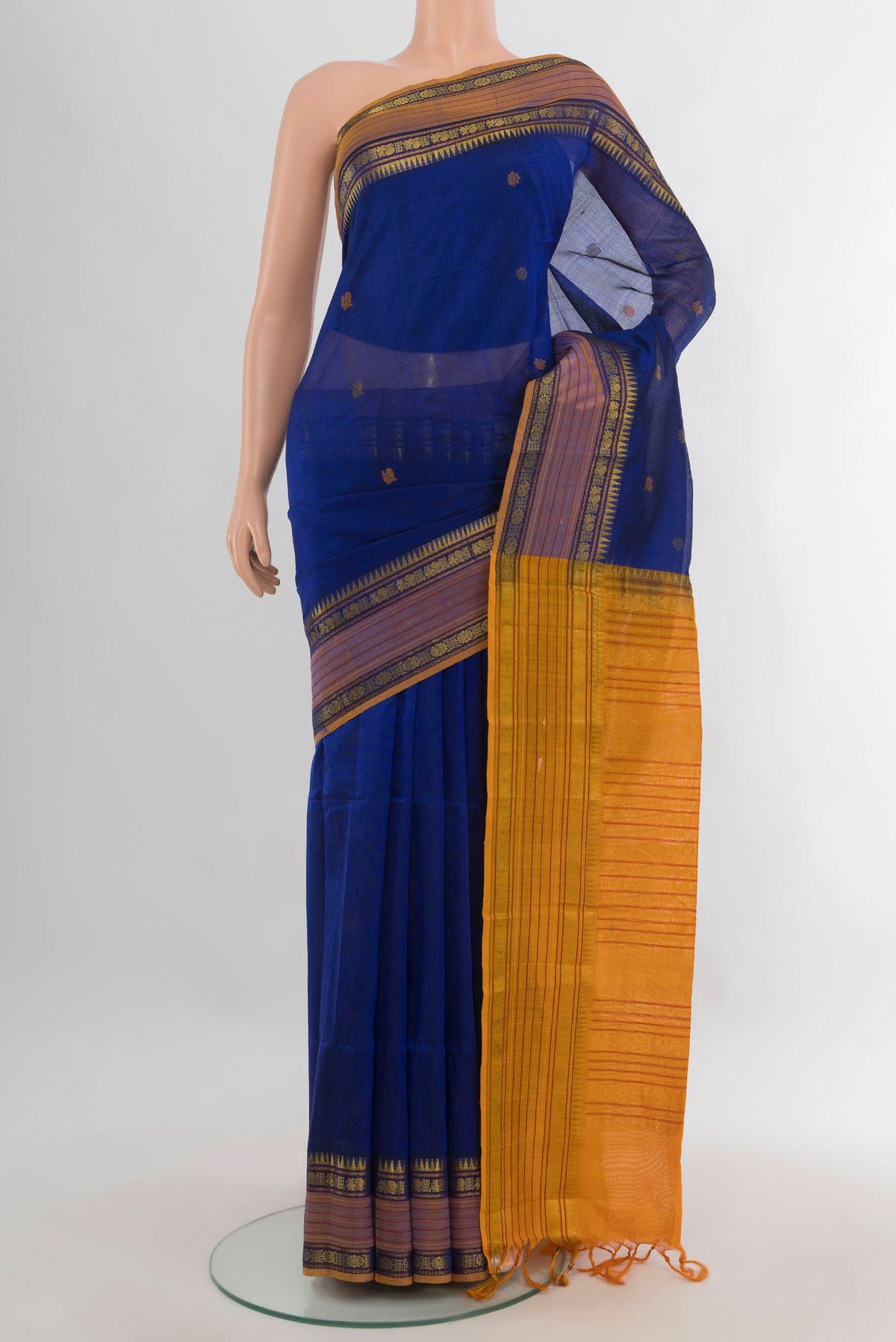 Dark Blue Silk Cotton Saree with Thread Butta on the body and Zari Border.  displayed on a mannequin