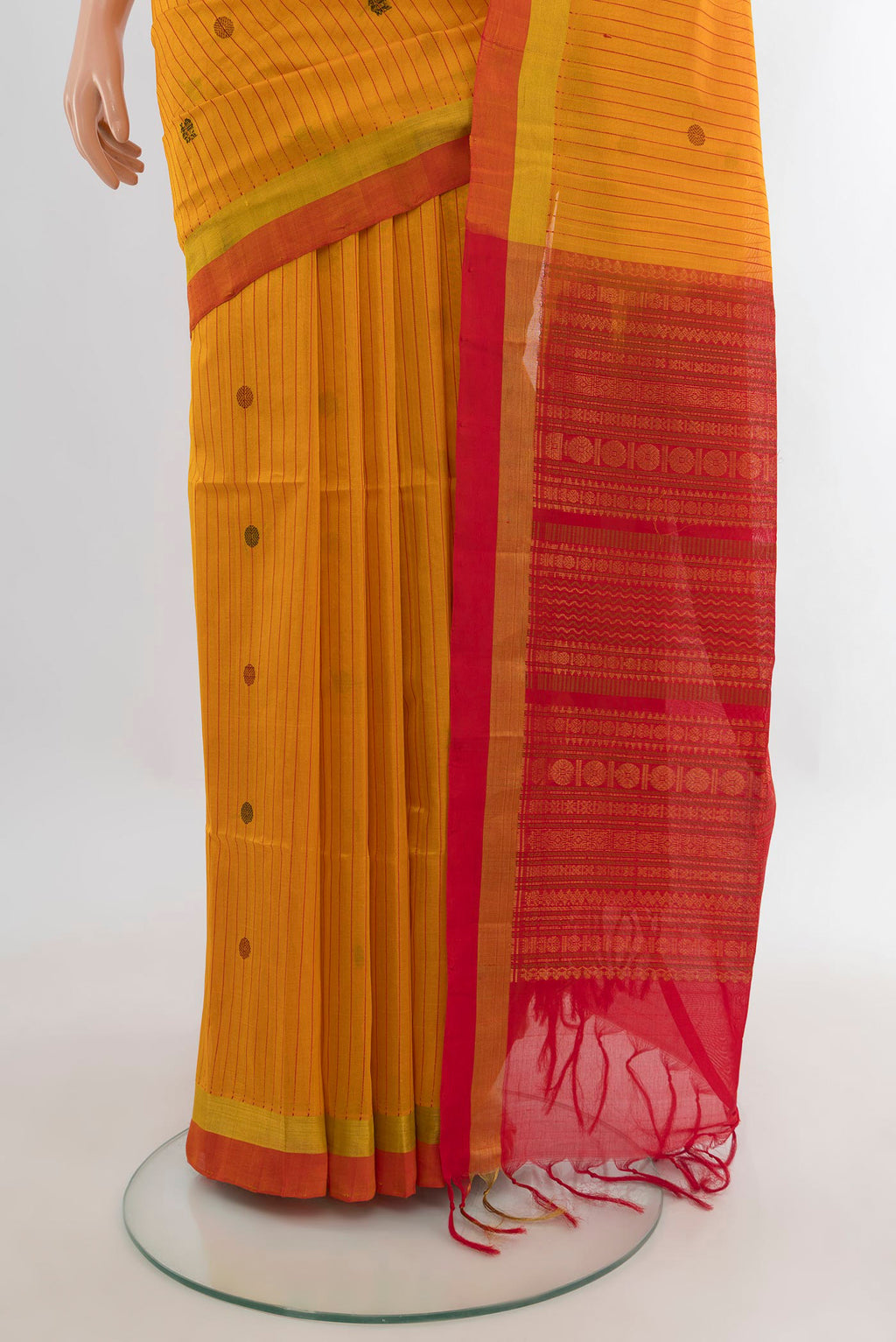Pleats and pallu of Mustard Silk Cotton Saree with Stripes on the body and Plain Border. 