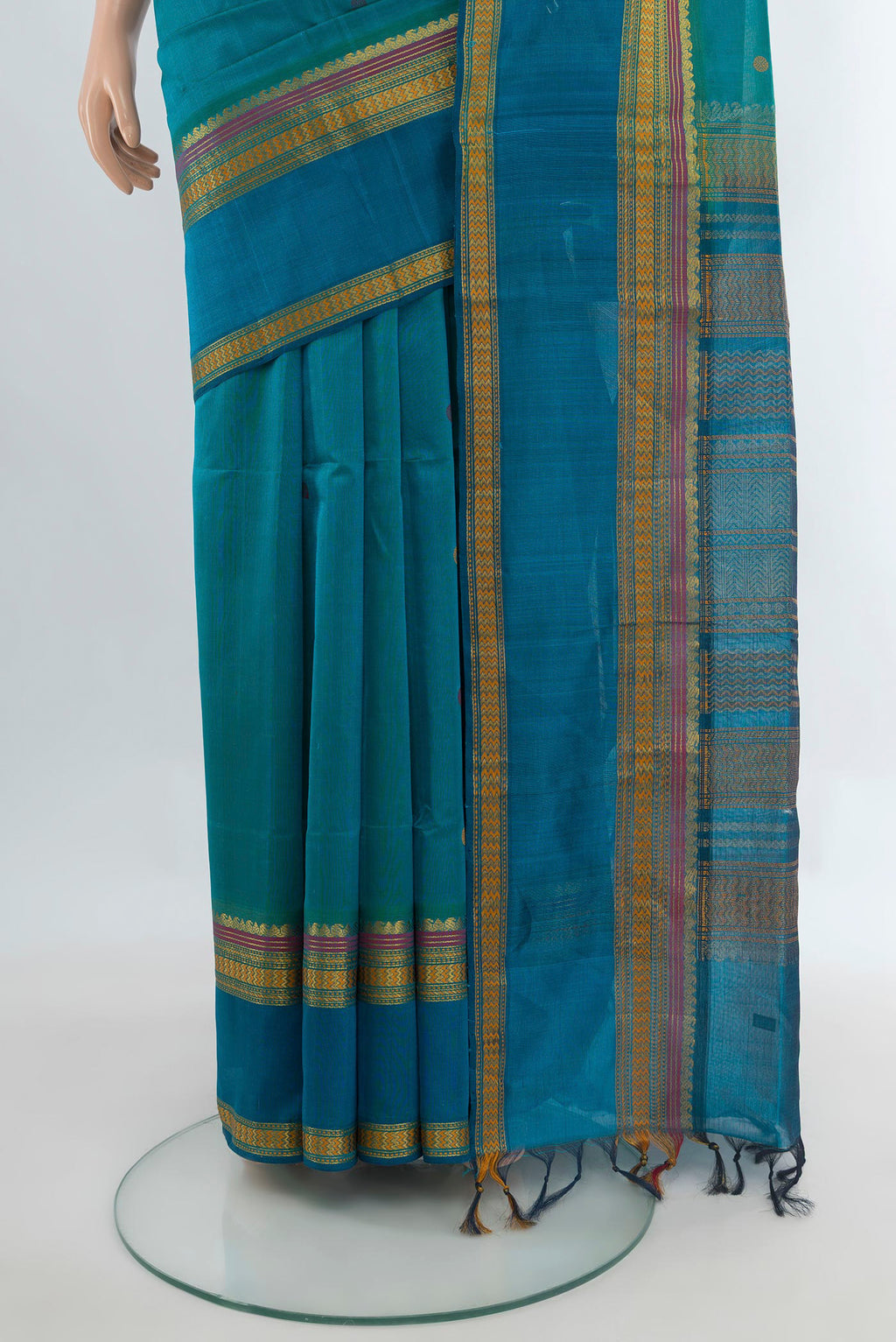 Pleats and pallu of Light Blue Silk Cotton Saree with Thread Butta on the body and Thread Border. 