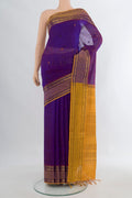 Purple Silk Cotton Saree with Thread Butta on the body and Zari Border.  displayed on a mannequin