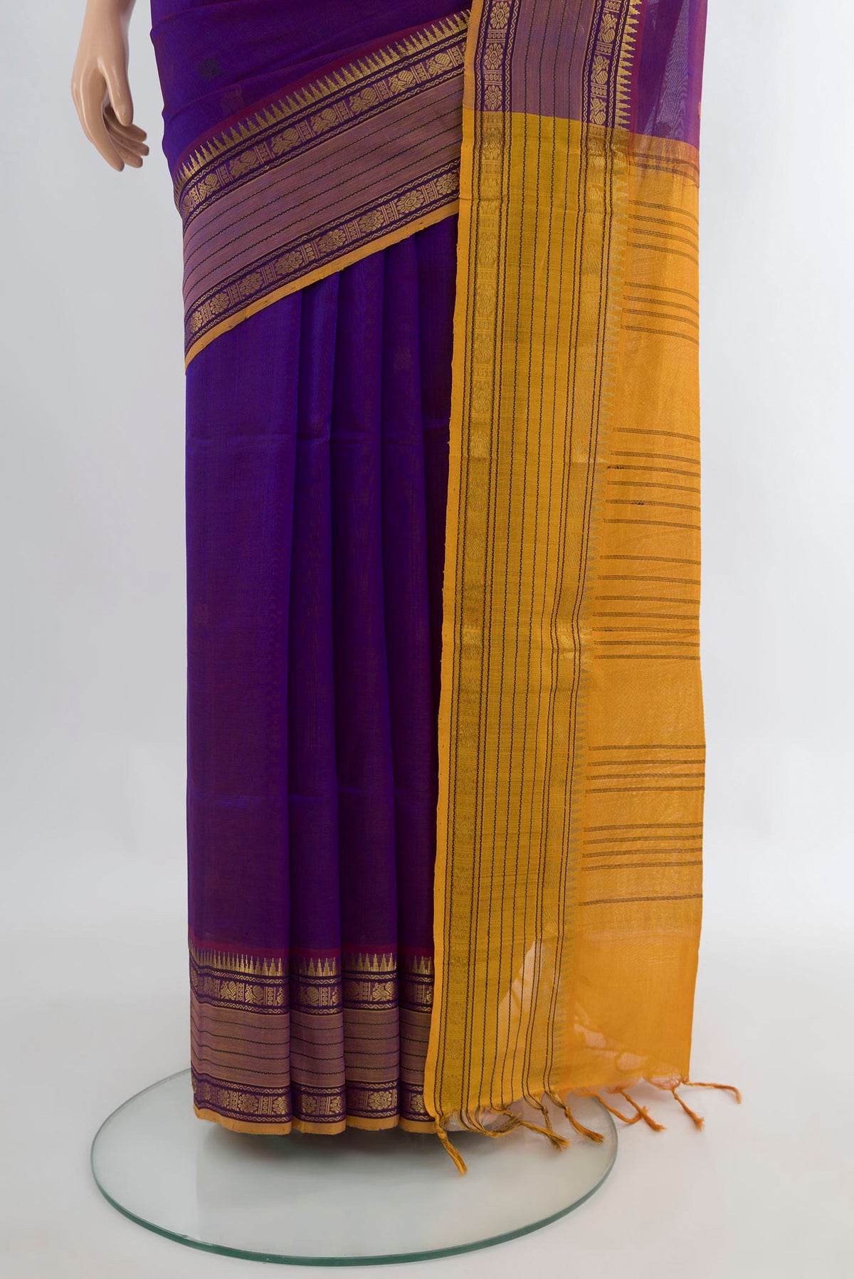 Pleats and pallu of Purple Silk Cotton Saree with Thread Butta on the body and Zari Border. 