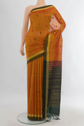 Mustard Silk Cotton Saree with Stripes on the body and Plain Border.  displayed on a mannequin