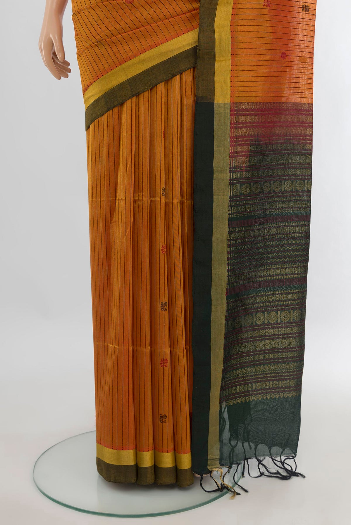 Pleats and pallu of Mustard Silk Cotton Saree with Stripes on the body and Plain Border. 