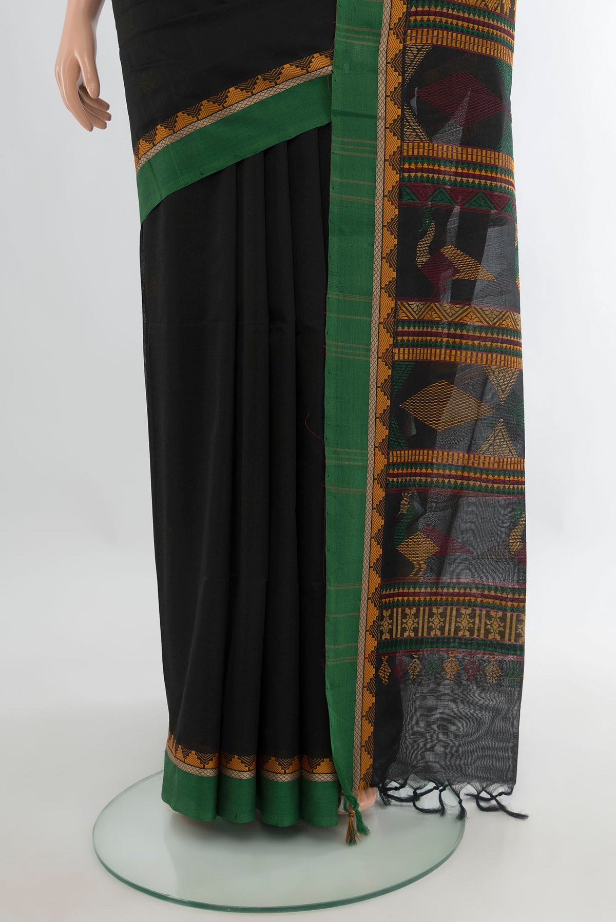 Pleats and pallu of Black Silk Cotton Saree with Thread Butta on the body and Plain Border. 