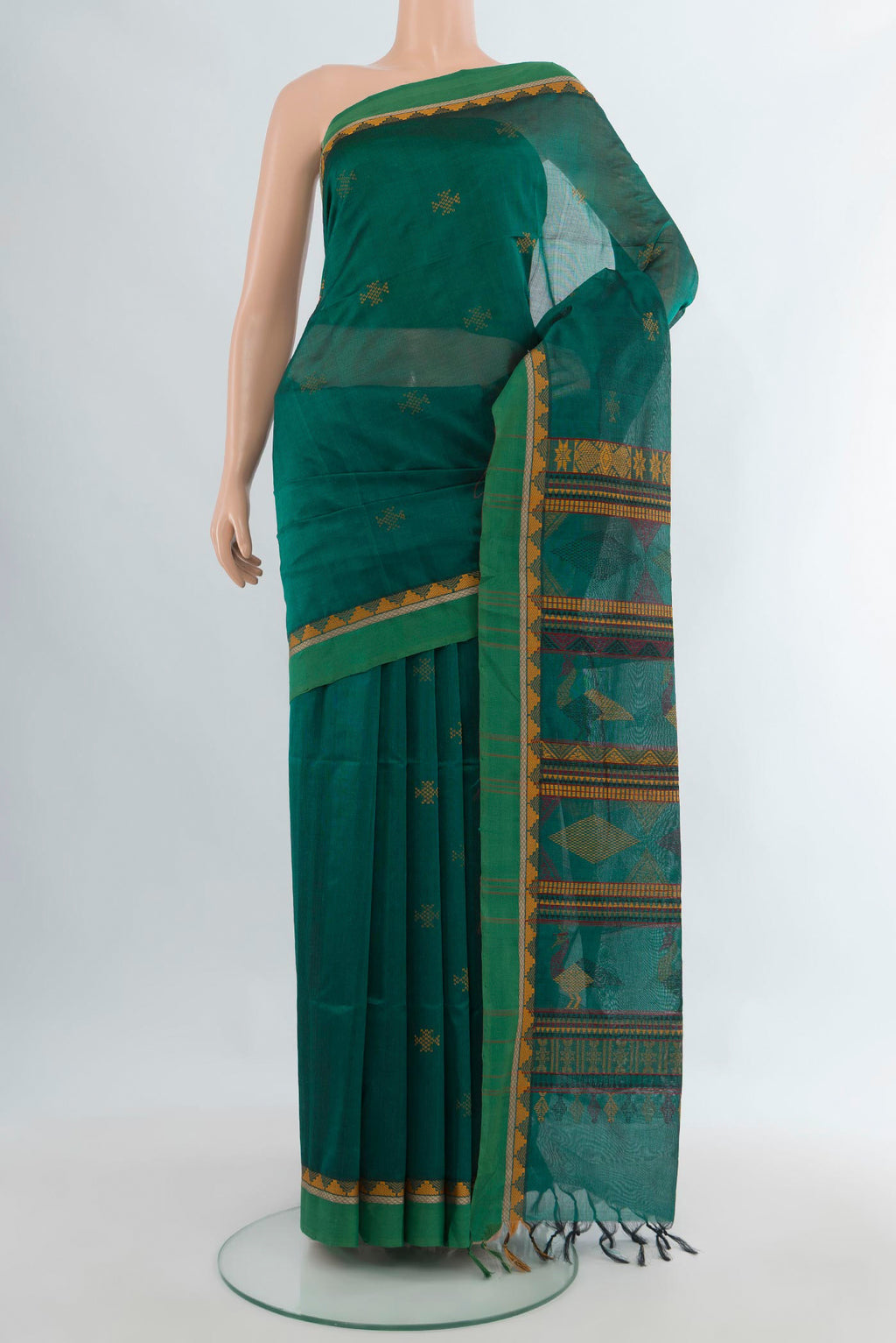 Green Silk Cotton Saree with Thread Butta on the body and Thread Border.  displayed on a mannequin