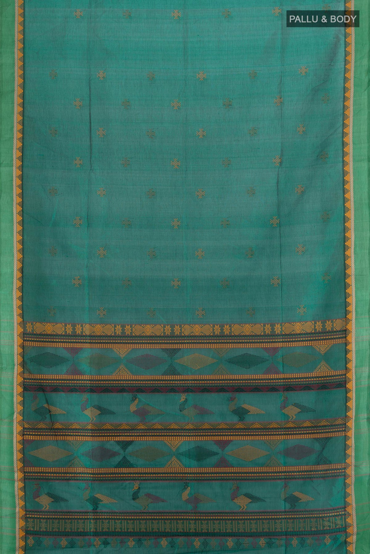 Flat view of Green Silk Cotton Saree with Thread Butta on the body and Thread Border. 