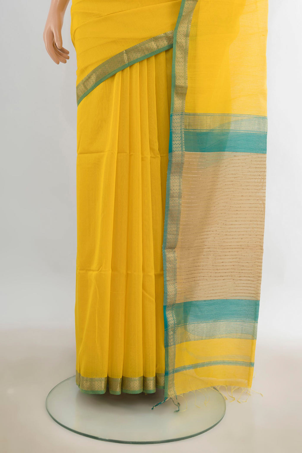Pleats and pallu of Yellow Maheshwari Cotton Saree with Plain Body and Zari Border. 
