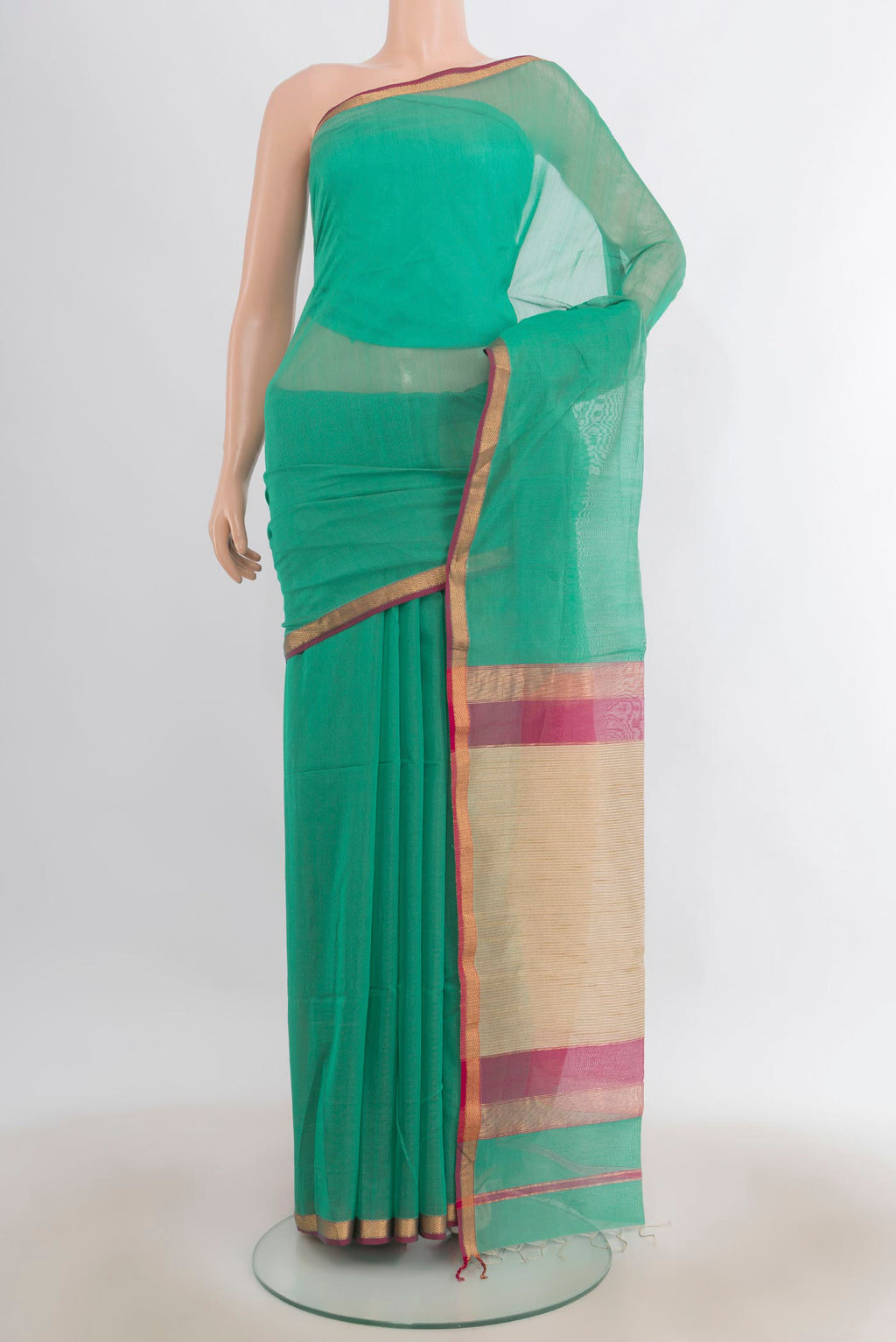 Sea Green Maheshwari Cotton Saree with Plain Body and Zari Border.  displayed on a mannequin