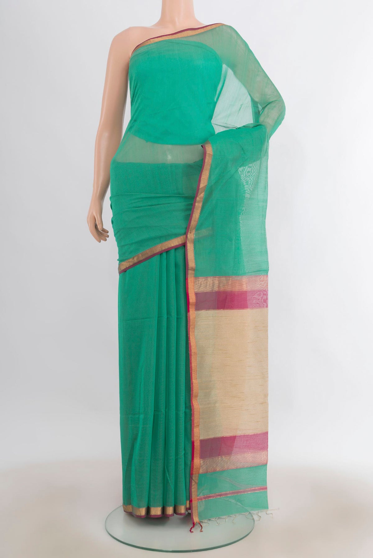 Sea Green Maheshwari Cotton Saree with Plain Body and Zari Border.  displayed on a mannequin