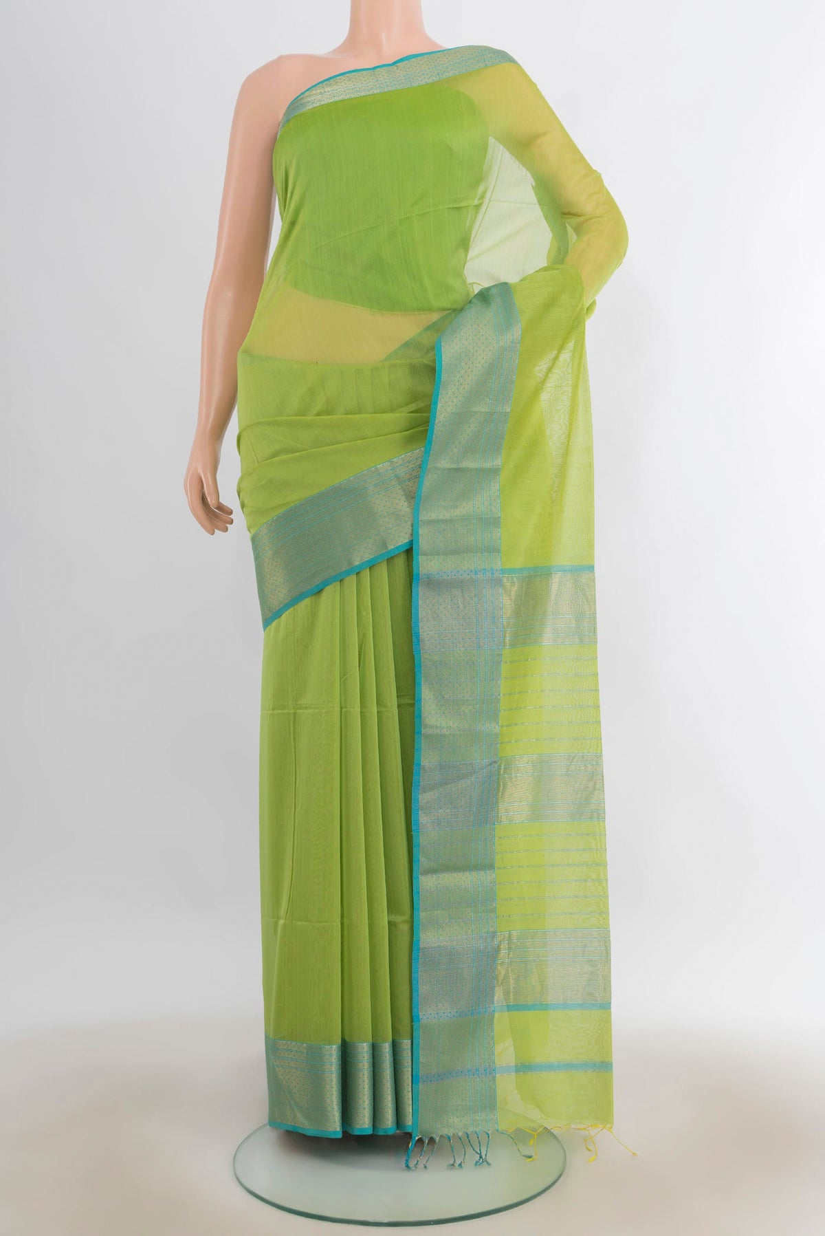 Light Green Maheshwari Cotton Saree with Plain Body and Zari Border.  displayed on a mannequin