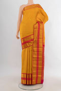 Pure Silk Mustard Kanjivaram Saree with Zari Butta on the body and Zari Border.  displayed on a mannequin