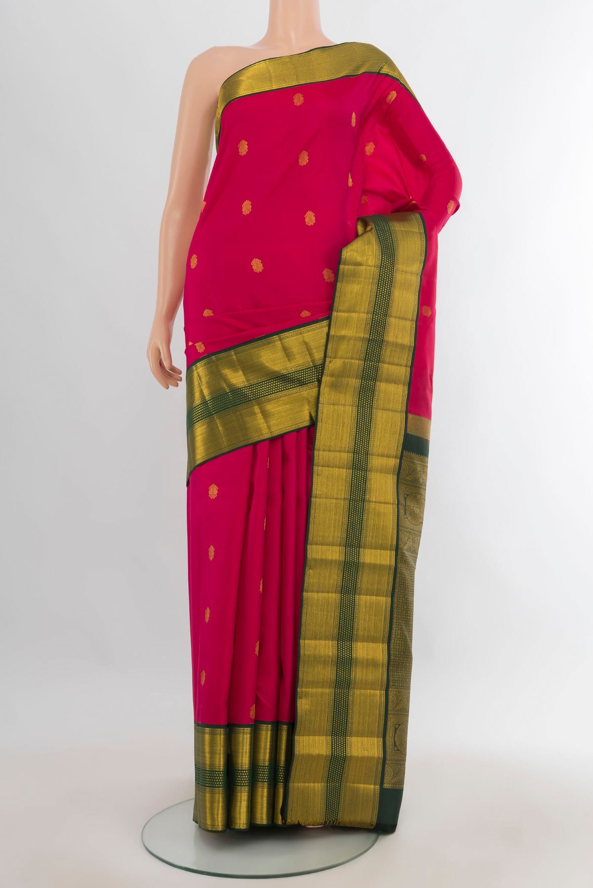 Pure Silk Dark Pink Kanjivaram Saree with Zari Butta on the body and Zari Border.  displayed on a mannequin