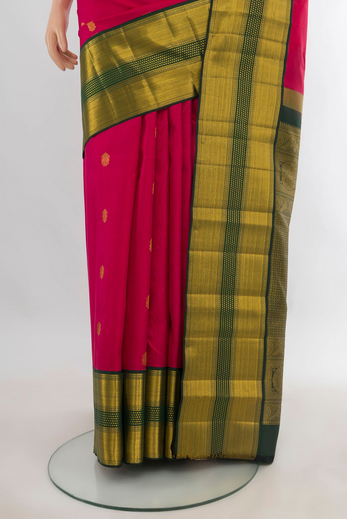 Pleats and pallu of Pure Silk Dark Pink Kanjivaram Saree with Zari Butta on the body and Zari Border. 