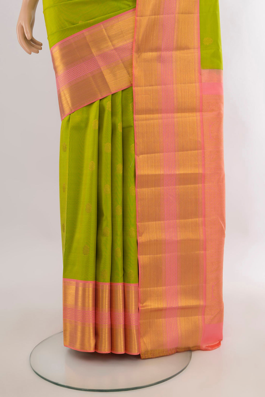 Pleats and pallu of Pure Silk Parrot Green Kanjivaram Saree with Zari Butta on the body and Zari Border. 